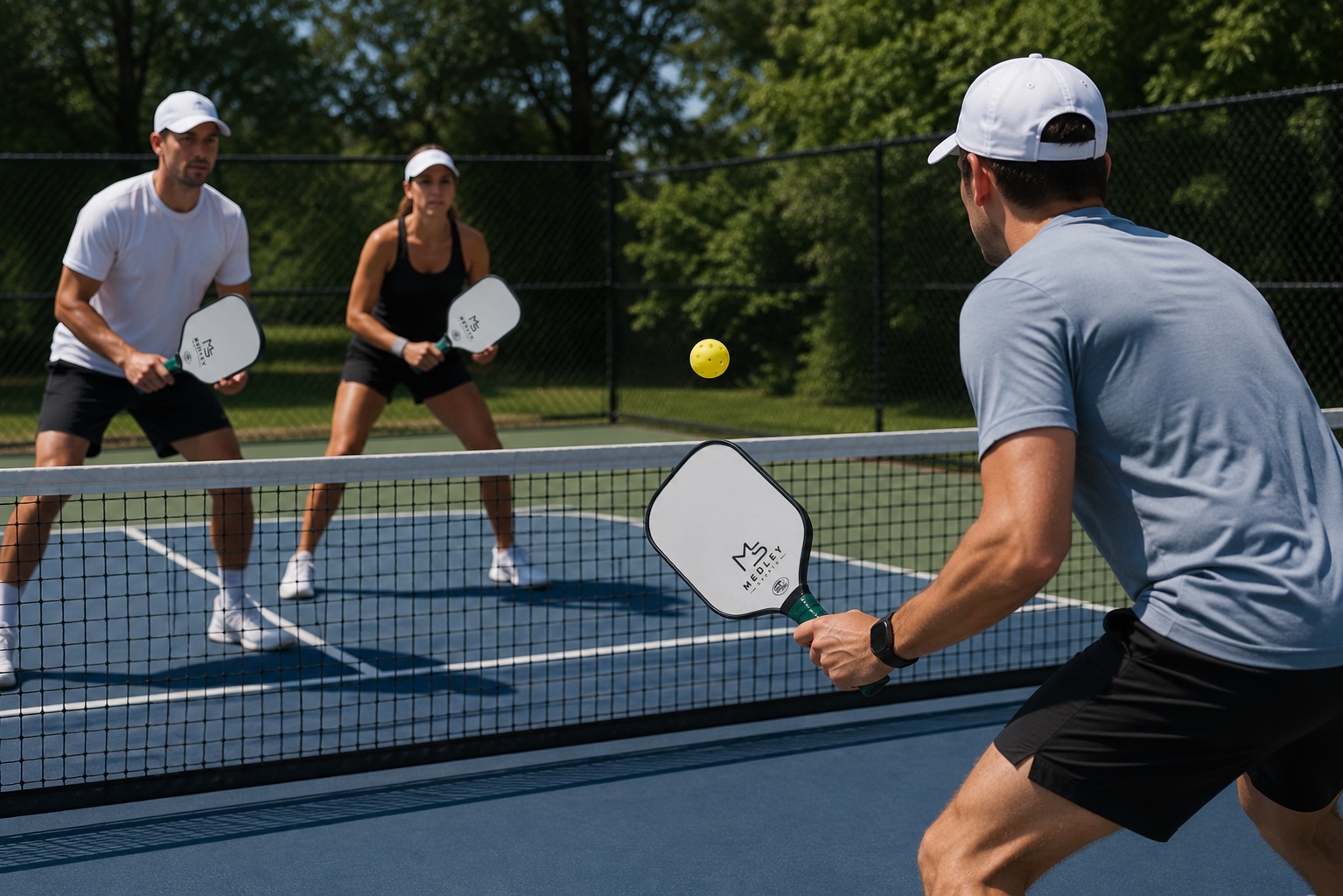 Players using Medley Sports paddles on a pickleball court